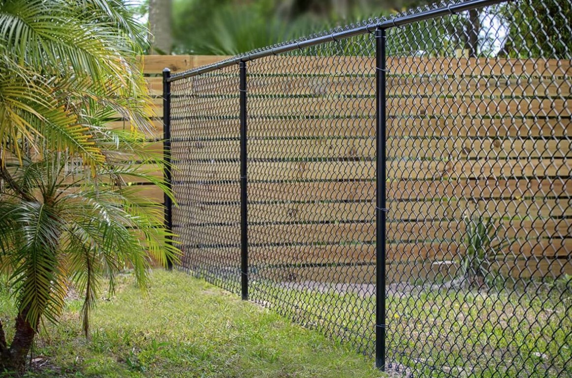 Commercial chain-link fence with tan privacy slats in Pike Road, Alabama